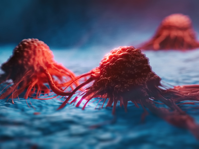 Rendering of cancer cells set against a blue background.