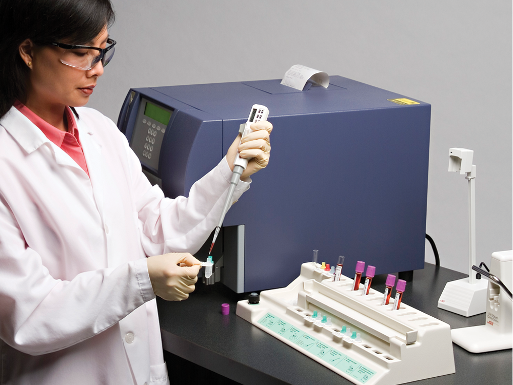 Scientist using BD FACSCount™ in a lab.